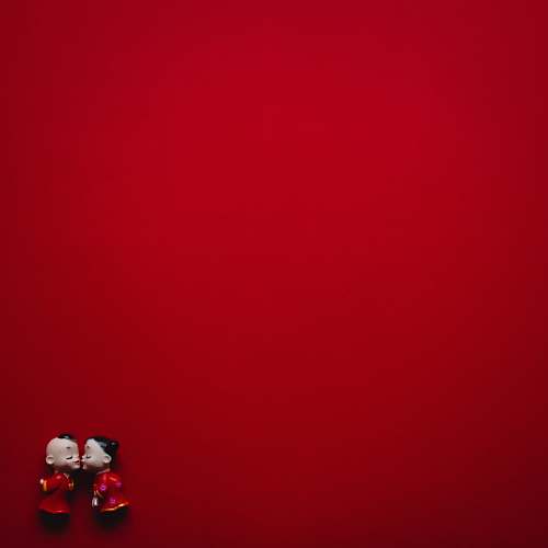 red girl and boy figurine wearing red dress valentine’s day